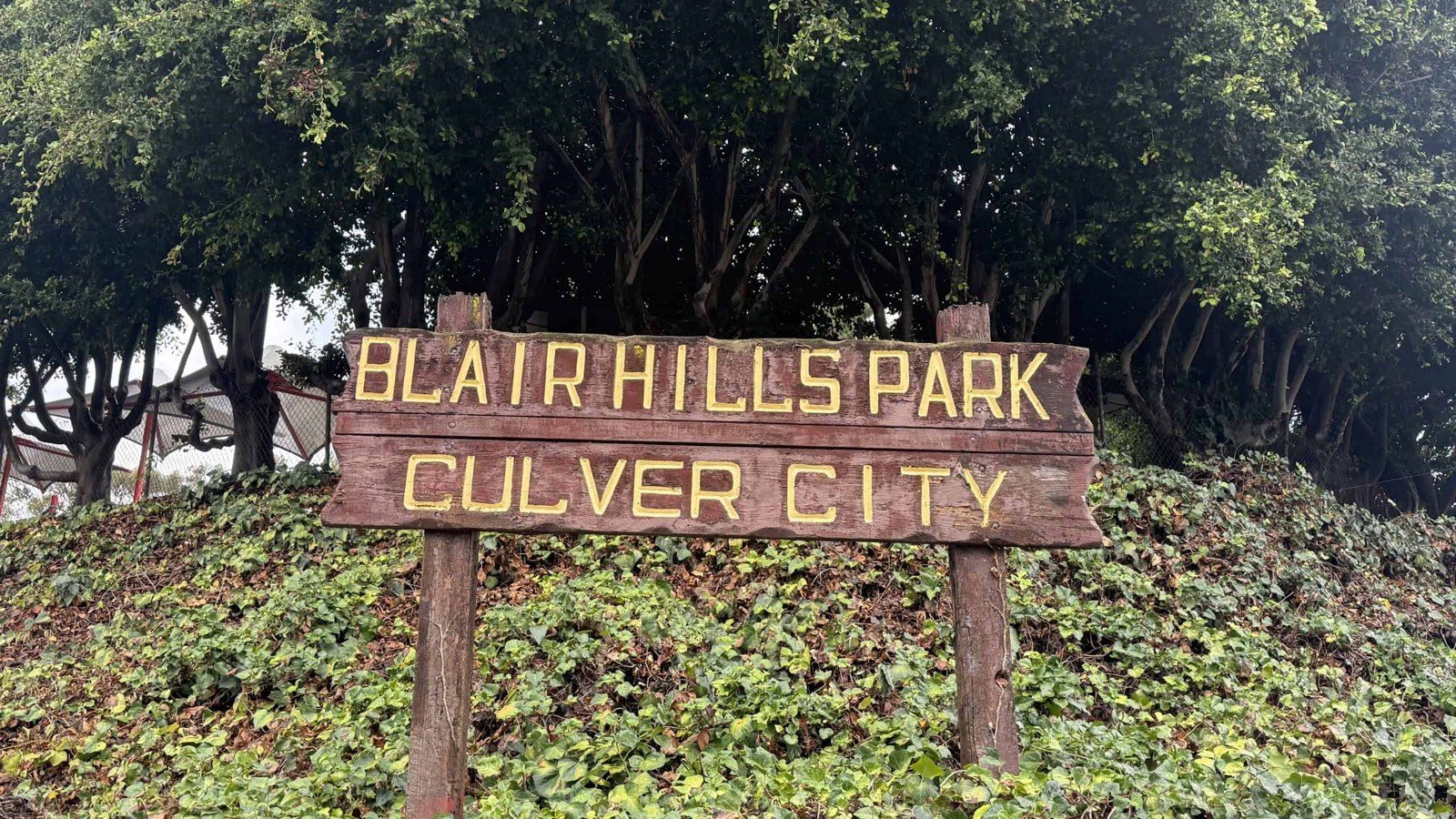 Wooden Blair Hills Park, Culver City sign among ivy
